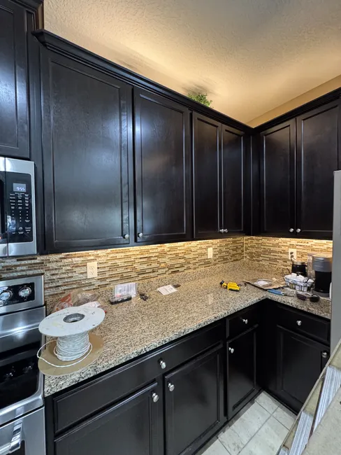 Damaged connections in under cabinet lighting were repaired, restoring an inviting glow to the kitchen.