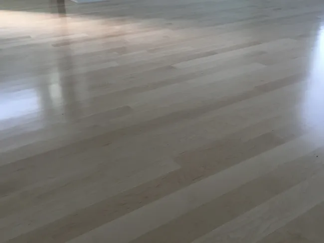 Maple flooring was installed, sanded, and finished, enhancing warmth and beauty in the home.