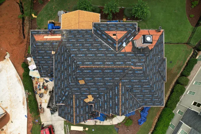 Repair and Replace on a beautiful roof in Norcross. Color: Desert Tan.