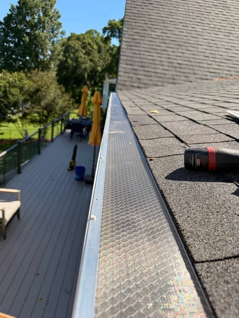 To enhance gutter functionality at a Mooresville residence, we installed Grizzly Gutter Guards, cleaned the system, and removed clogs, ensuring optimal water flow and long-lasting protection.