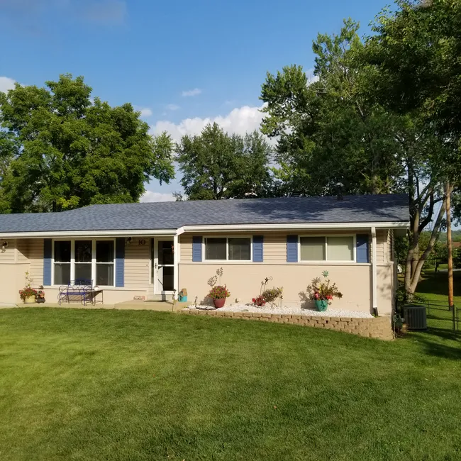 In Saint Louis, we upgraded an outdated roof and installed seamless white gutters for enhanced protection and style.