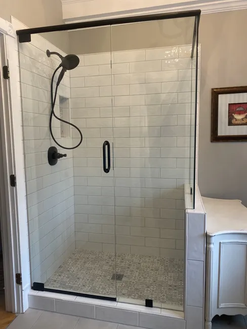 3 Panel Frameless Glass Shower Enclosure with Oil Rubbed Bronze Hardware - We used a
