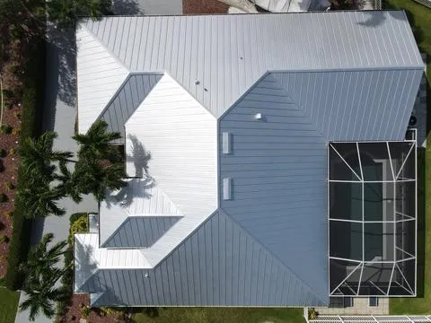 The worn tile roof was replaced with a durable metal roof, enhancing protection and boosting curb appeal.
