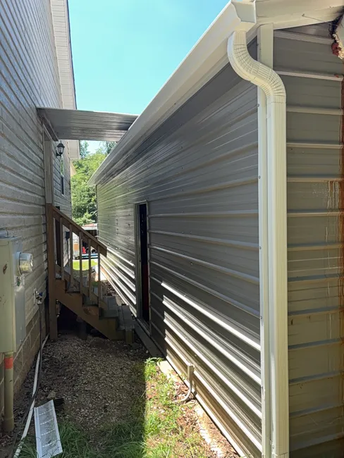 New 6-inch seamless gutters were installed to enhance drainage, ensuring effective rainwater management for this Mooresville home.