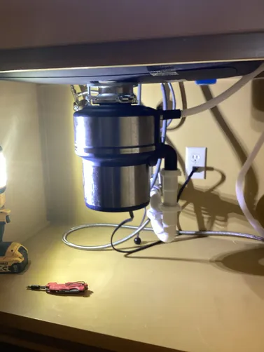 photo at Home, TX on Feb 28, 2026: A leak was detected coming from an eight-year-old garbage disposal unit that could not be repaired. photo at Home, TX on Feb 28, 2026: A leak was detected coming from an eight-year-old garbage disposal unit that could not be repaired.