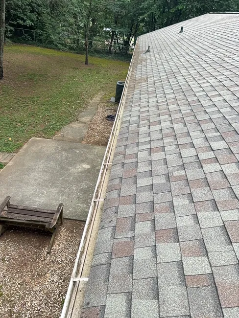 Clogged gutters prompted a thorough cleaning at this Statesville home, ensuring proper drainage and protecting its exterior.