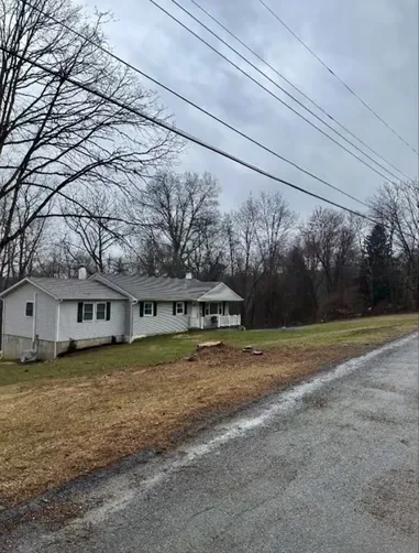 photo at Wappingers Falls, NY on May 18, 2022: The sloping issues in the lawn prompted us to grade the area, lay down soil and seed to establish a