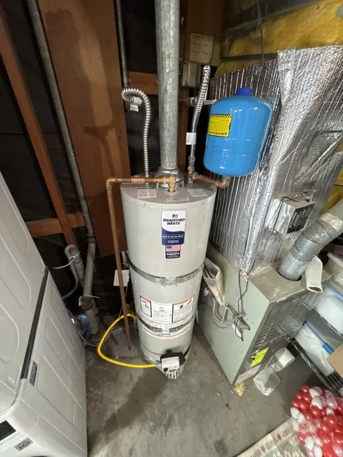 An aging 40-gallon water heater was replaced, restoring reliable hot water and efficiency for the homeowner.