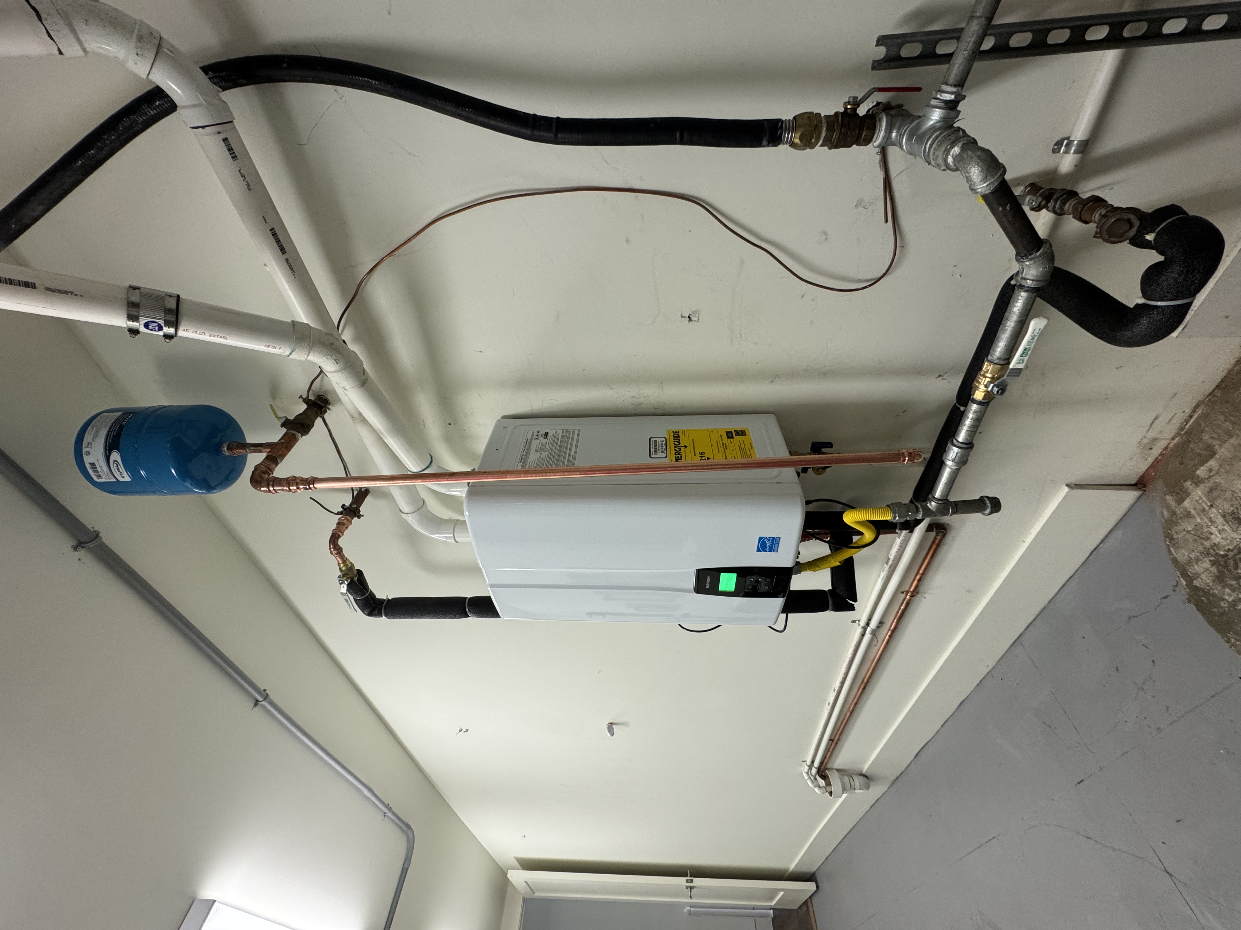 Navien tankless water heater installed in Kentfield replacing a 75 gallon tank