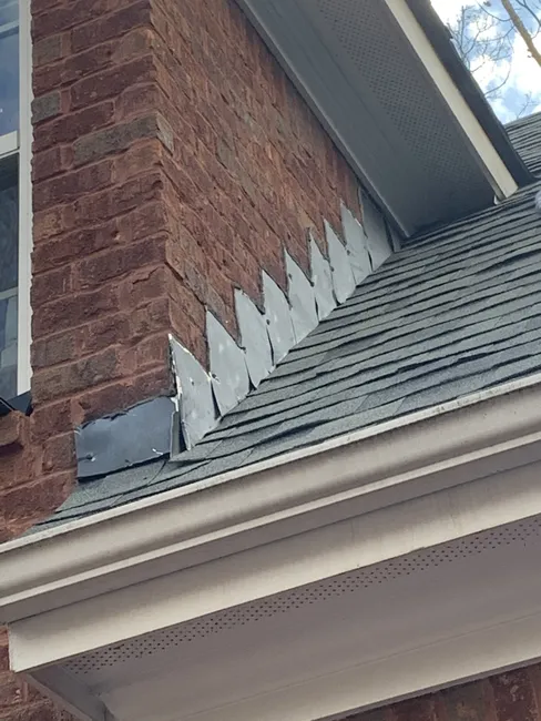 Repaired and replaced the flashing while replacing the roof. This will extend the waterproofing and make sure this roof survives as long as possible.