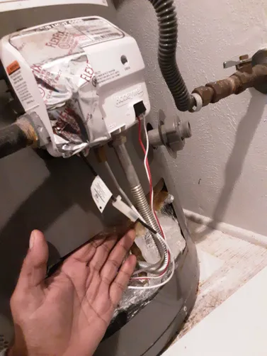 photo at Stafford, TX on Dec 01, 2025: We discovered a leak at the bottom of the water heater, signaling a need for urgent action. After a