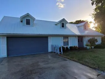 Rusted fasteners were replaced, and the roof was pressure washed, ensuring lasting integrity and protection.