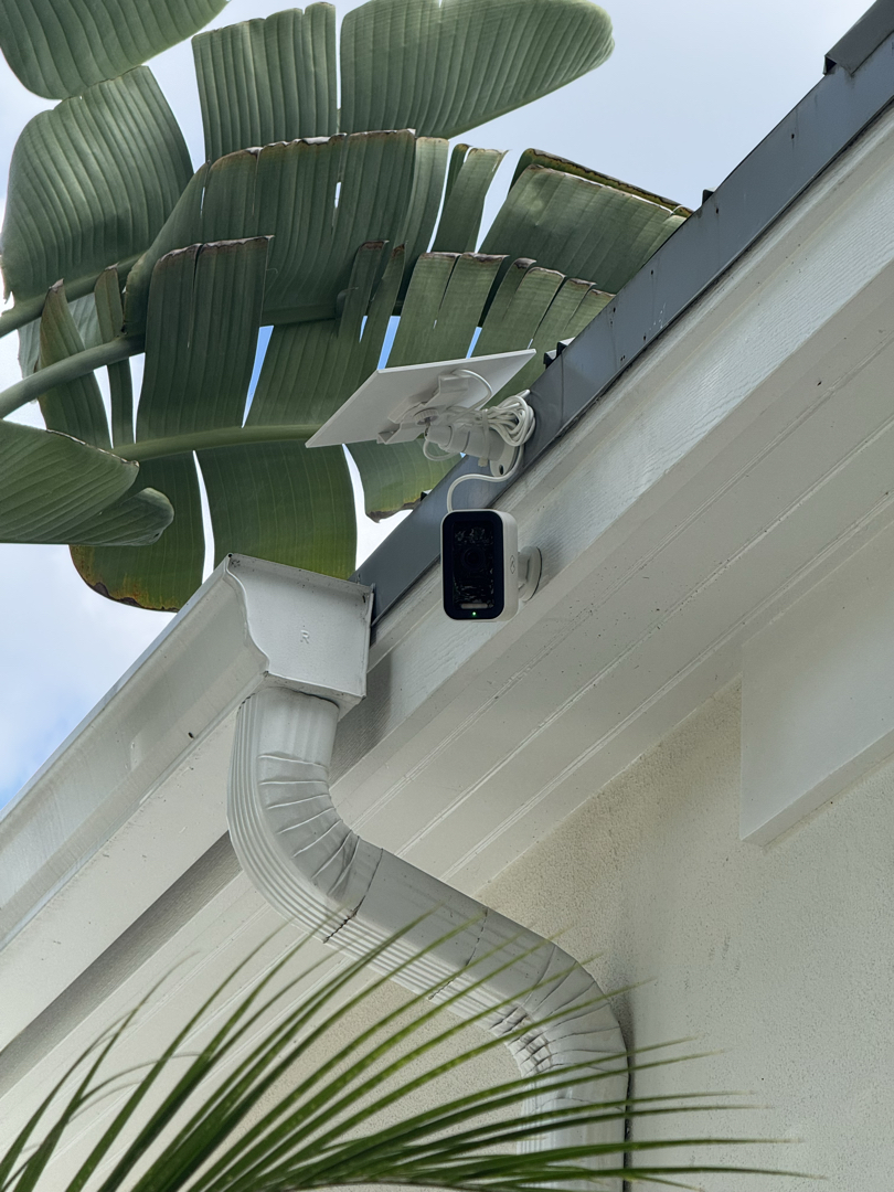 Solar-powered security camera mounted on the front of a Sarasota home