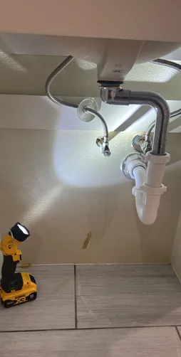 photo at Houston, TX on Nov 17, 2025: A leak was discovered under the sink caused by a damaged brass pipe, which required immediate atten