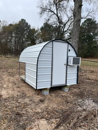 photo at undefined, TX on Dec 22, 2025: 6x8 dog house in brilliant white with black trimsolid flooring, heat, ac, insulation, light, doggy