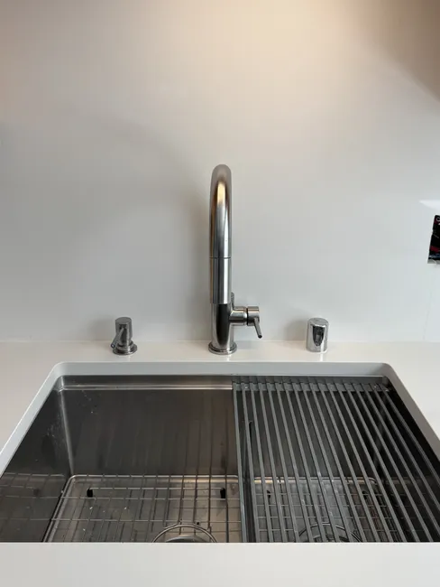 Upgraded an outdated faucet and installed an air-gap soap dispenser, enhancing both functionality and style in the kitchen.
