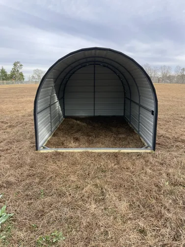 photo at Ore City, TX on Jan 09, 2026: 8x12 open animal shelter in charcoal with black trim 6x8 dog house(solid floor, enclosed back room