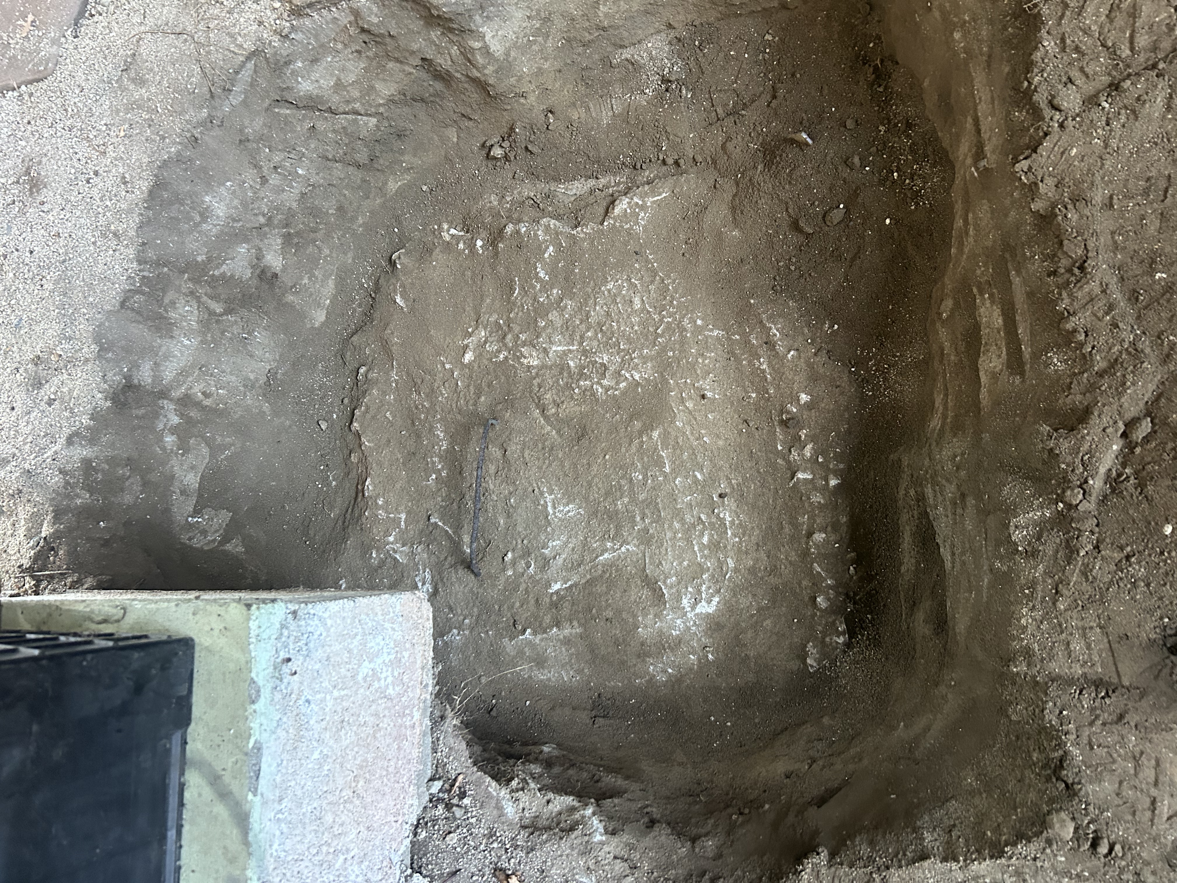 Excavation down to the septic tank inlet at a home in Campo