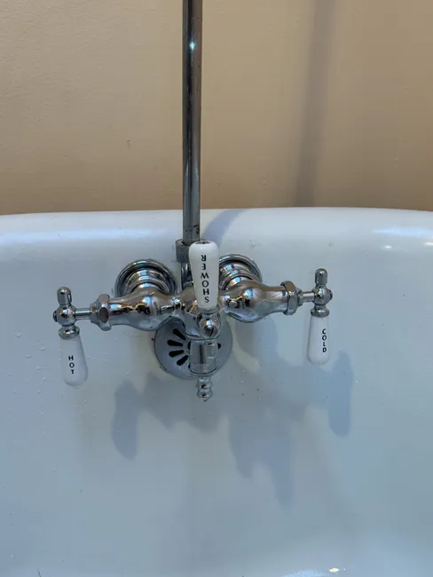 A leaking tub filler valve was replaced and upgraded with new angle stops, restoring water flow and bathroom function.