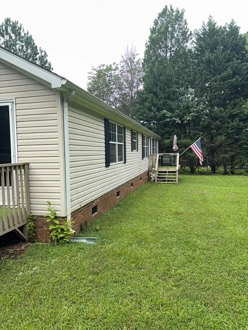 Clogged gutters were cleared in Mooresville, preventing water damage and enhancing system longevity.