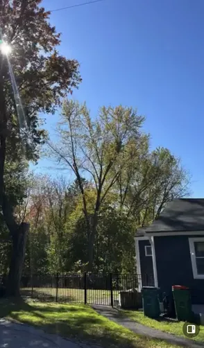 photo at Poughkeepsie, NY on Oct 18, 2024: A large damaged limb from a maple tree was overhanging the home and property, posing a safety risk 