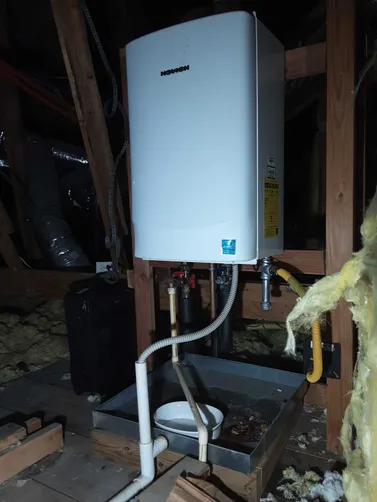 photo at undefined, TX on Nov 20, 2025: A water leak from the tankless water heater's pipe connections required immediate attention. We rep