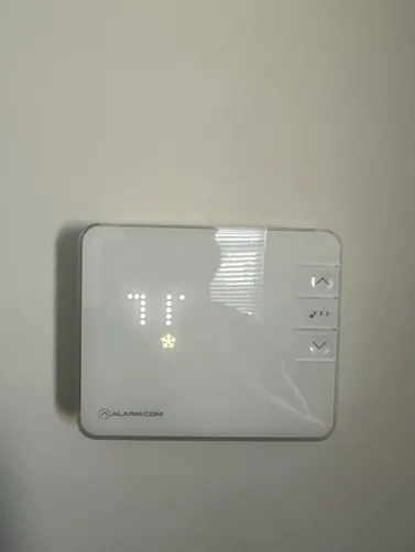 Thermostat photographed during the Pelham upstairs HVAC repair