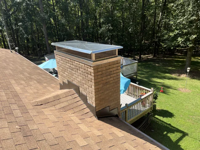 The customer needed a roofer to replace some rotten wood and chimney flashings. They chose us to be their roofing contractor, and we were also able to install a quality chimney cap.