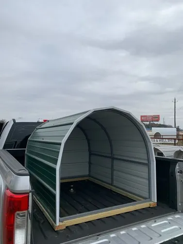 photo at Palestine, TX on Dec 17, 2025: 4x5.5 Open front animal shelter- hunter green with white trimPicked up from our Canton, TX lot