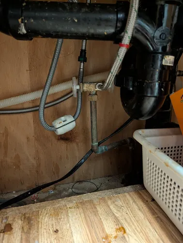 photo at Martinez, CA on Mar 24, 2026: A malfunctioning dual angle stop under the kitchen sink was causing issues for the homeowner. We re