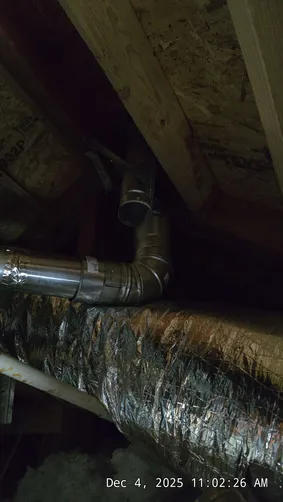 photo at Brian Head, UT on Dec 04, 2025: A furnace issue was identified in the attic above the garage, where the B-vent had become disconnec