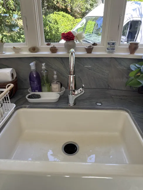 A leaking, outdated kitchen faucet was replaced with a modern fixture, enhancing functionality and protecting against future leaks.