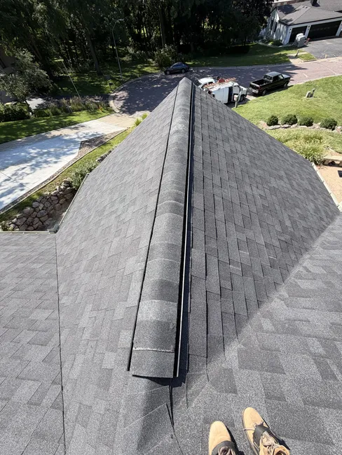 A compromised roof was revitalized with new ridge vents, capped shingles, and updated drip edge for lasting integrity.
