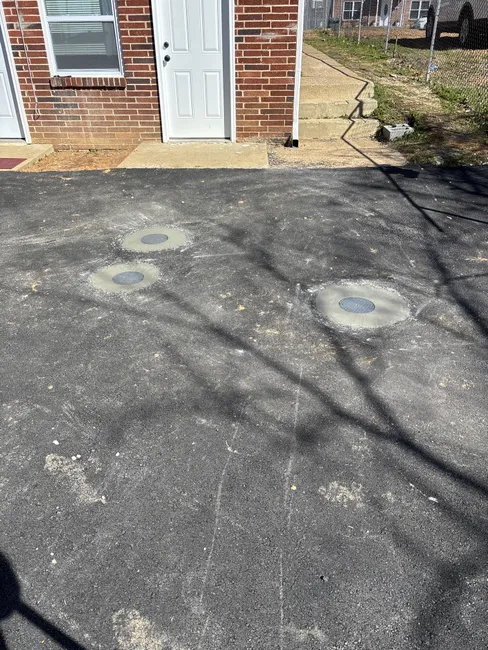 We installed traffic-rated clean-out boxes, enhancing drainage efficiency and ensuring easy maintenance access.