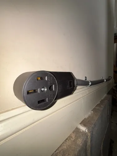 Installed a new NEMA 14-50r EV Charger. Installed a new Eaton BR 50A breaker. Pulled a 70ft run of 6-3 romex from panel to device location.