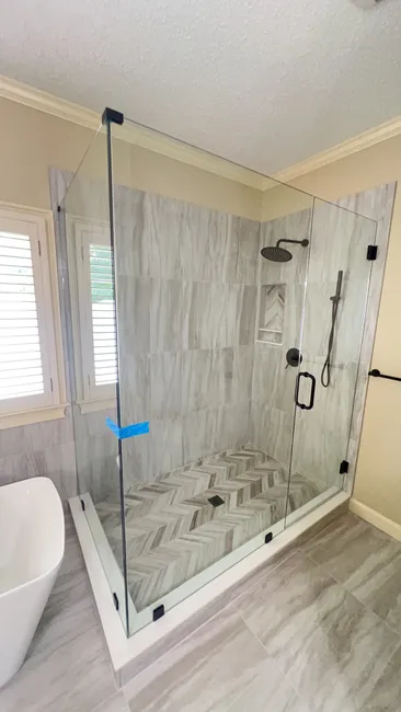 Customized two-panel and three-panel swing doors were expertly installed, enhancing the elegance and functionality of this home's bathrooms.