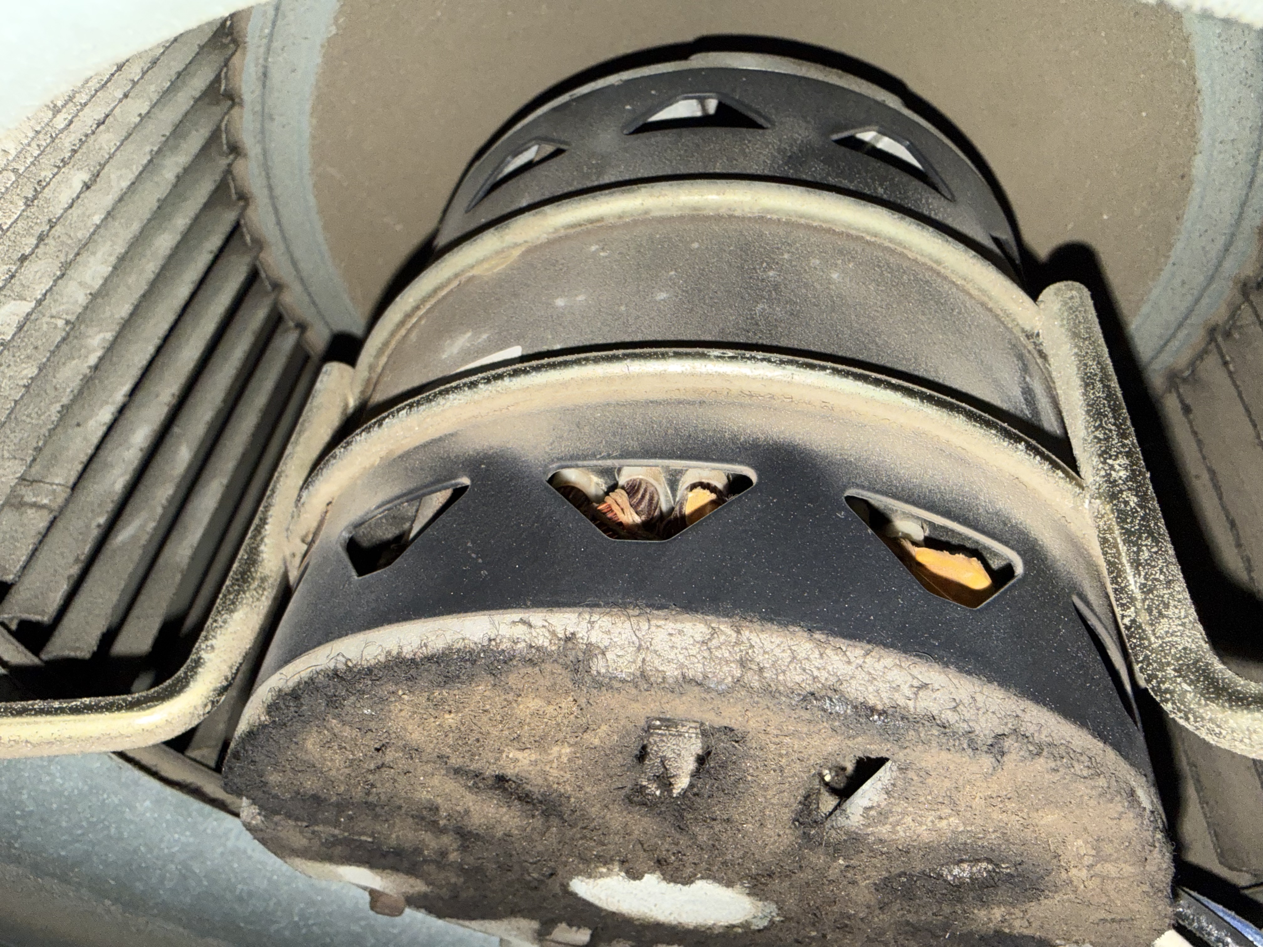 Dust accumulation inside a blower motor housing during an AC tune-up in Roseville, CA