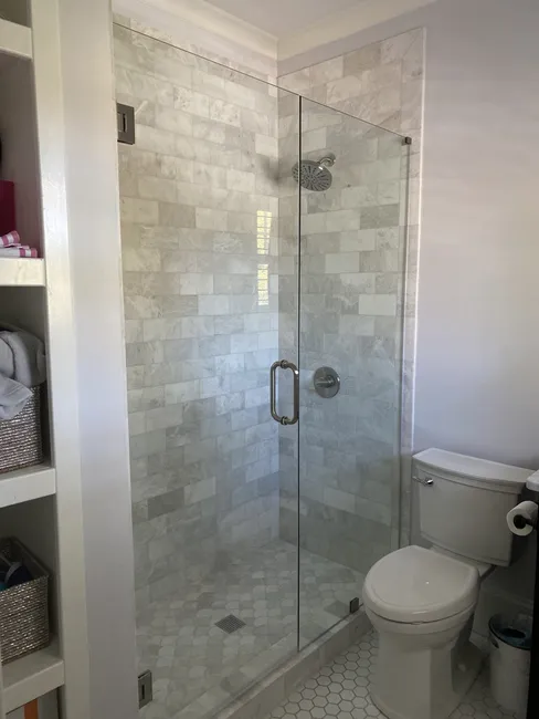 Three 2 panel frameless glass shower enclosures