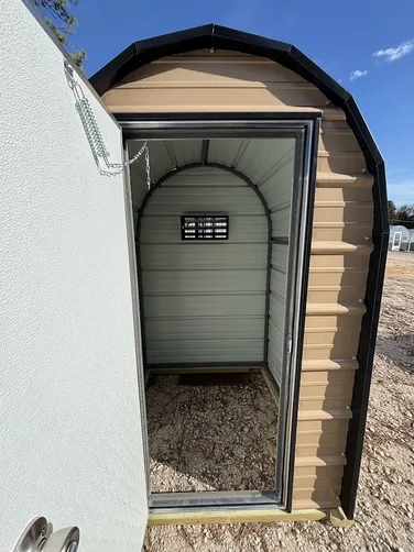 photo at Canton, TX on Jan 12, 2026: 4x4 well shed with man door-no floor-welded frame-treated base - tan with black trimpicked up from