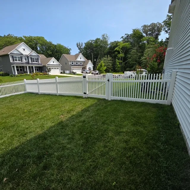 A stunning white vinyl picket fence in the Wharton creek style was installed, enhancing the property's elegance.