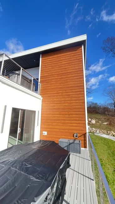 We installed a durable rubber roof, refreshed vinyl siding, and custom-trimmed doors for lasting quality and curb appeal.