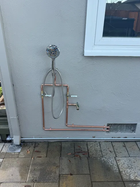 A new outdoor shower installation enhances outdoor enjoyment while ensuring safe plumbing standards. #outdoorshower #newinstall #plumbingservices