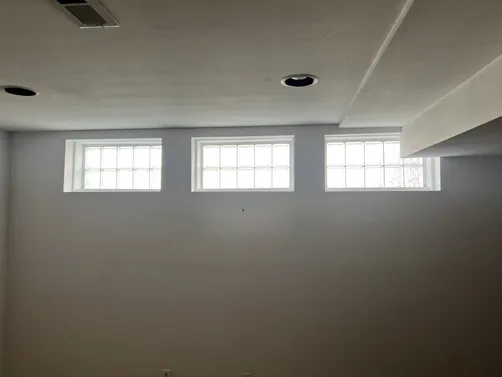 photo at St Louis, MO on Dec 19, 2024: To enhance the comfort of the living space, we installed four room darkening white spring roller sh