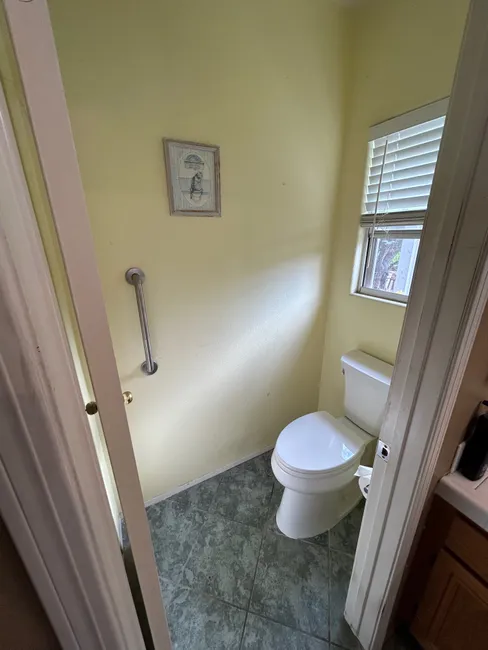An ADA height Kohler elongated toilet was installed for enhanced comfort and accessibility in the master bathroom.