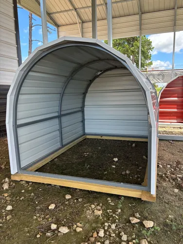 photo at Chandler, TX on Dec 17, 2025: 4x5.5 open front animal shelter in Lightstone with white trimPicked up from our Longview, TX locat