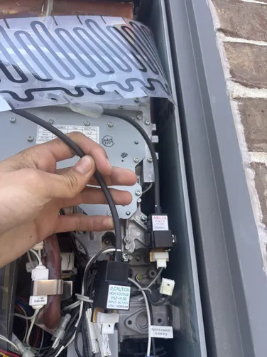 photo at Atascocita, TX on Sep 08, 2025: The ignitor coil was malfunctioning, which disrupted the tankless water heater's operation. We repl