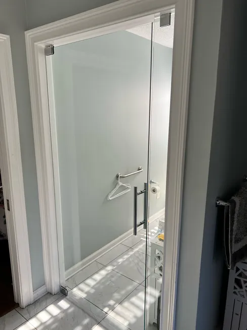 Two panel toilet room entry with chrome hardware