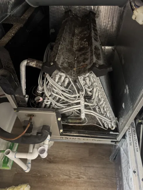 Addressing low refrigerant levels and an evaporator coil leak, we restored the HVAC unit's efficiency for this homeowner.