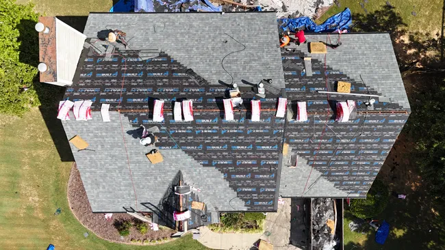 After assessing damage, we replaced Charlley’s roof with durable Owens Corning Duration shingles in Estate Gray.