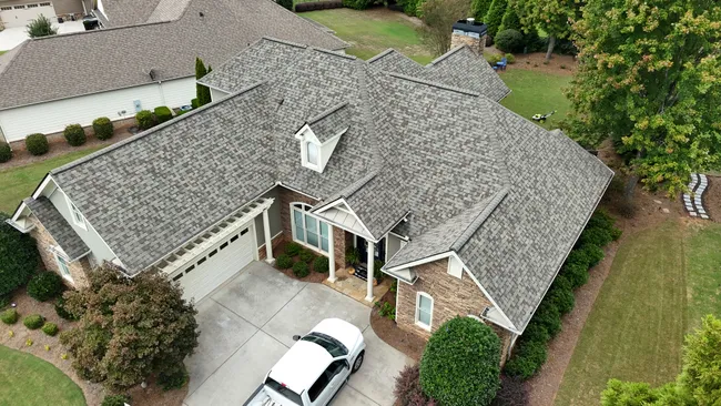 Bobby’s damaged roof was replaced with Owens Corning Duration shingles in Driftwood, enhancing his home’s value and durability.